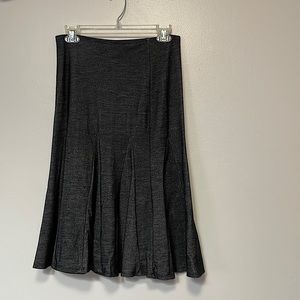 Charcoal color skirt.